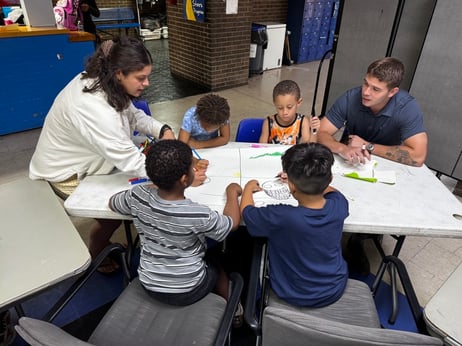 Celina and joe with kids working